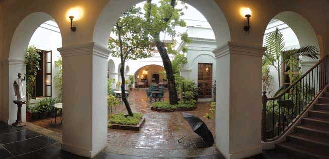 Hotel De L Orient Pondicherry Hotels And Reosrts In Pondicheery Art Treasures French Colonial Beds Chests Of Drawers Intricate Study Tables Planters Chairs Pondicheriennes Interesting Lamps And Objects